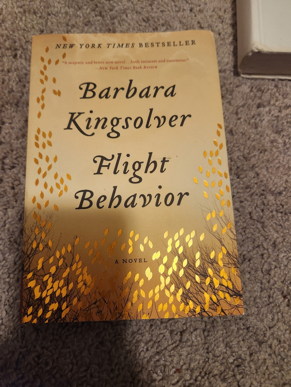 Barbara Kingsolver "Flight Behavior" Paperback Book - Cream and Gold Cover